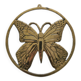 Brass trivet depicting a butterfly