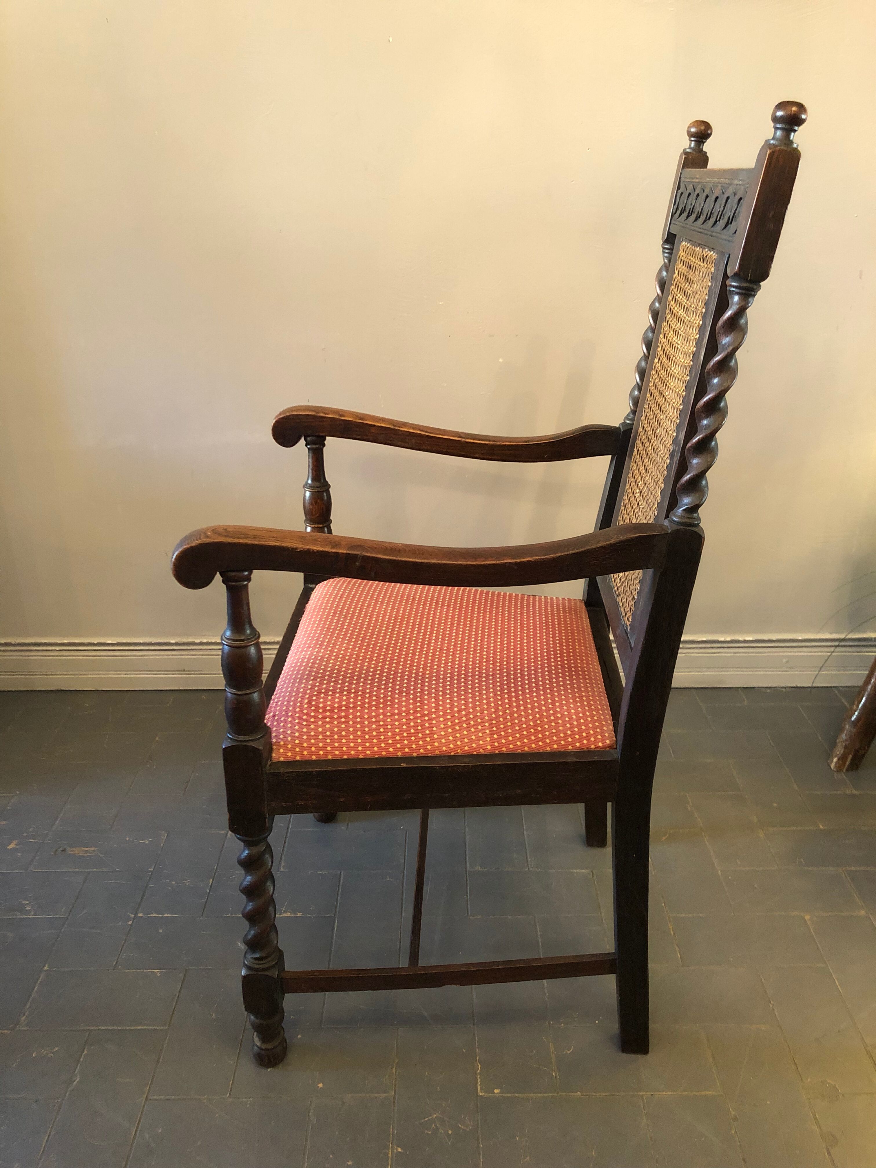 Carved wooden armchair and cannage
