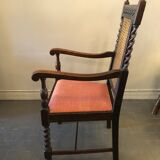 Carved wooden armchair and cannage