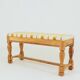 Vintage oak bench with striped linen fabric in a country style.