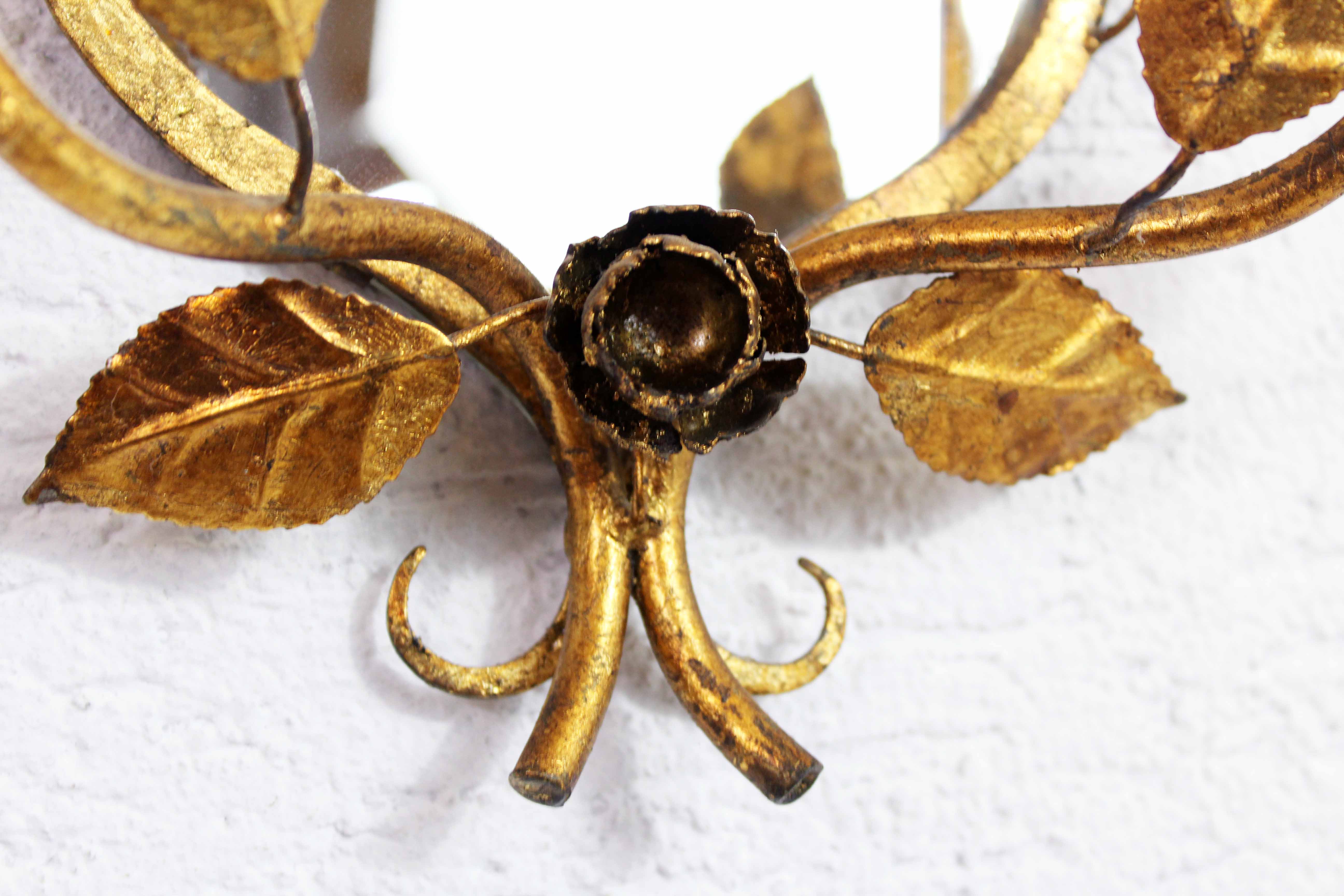 Old candlestick mirror gilded with leaf