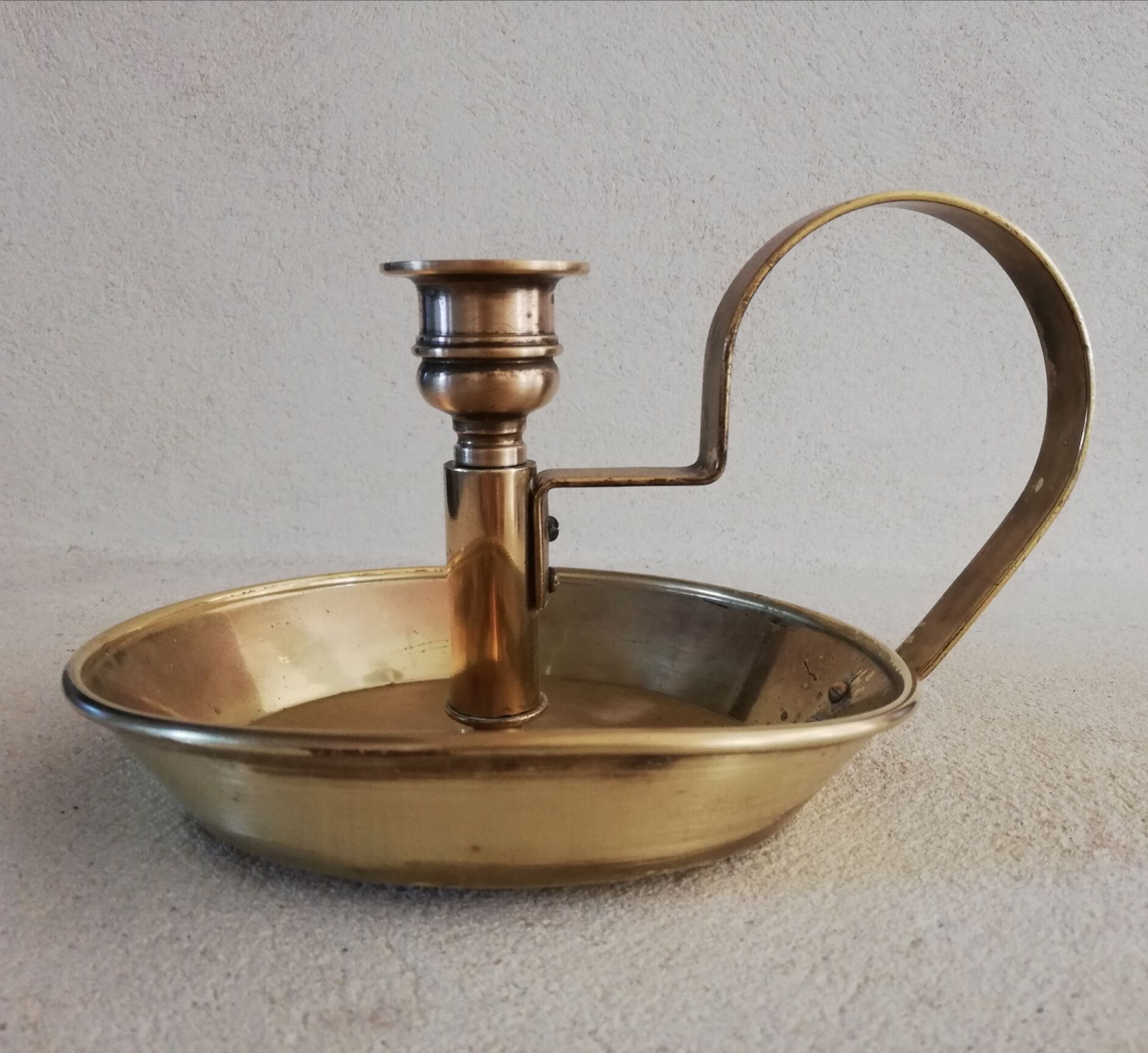 Brass hand candle holder