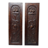 Pair of decorative wall panels in carved wood from the 19th century.