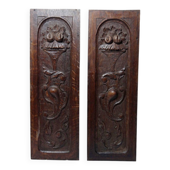 Pair of decorative wall panels in carved wood from the 19th century.