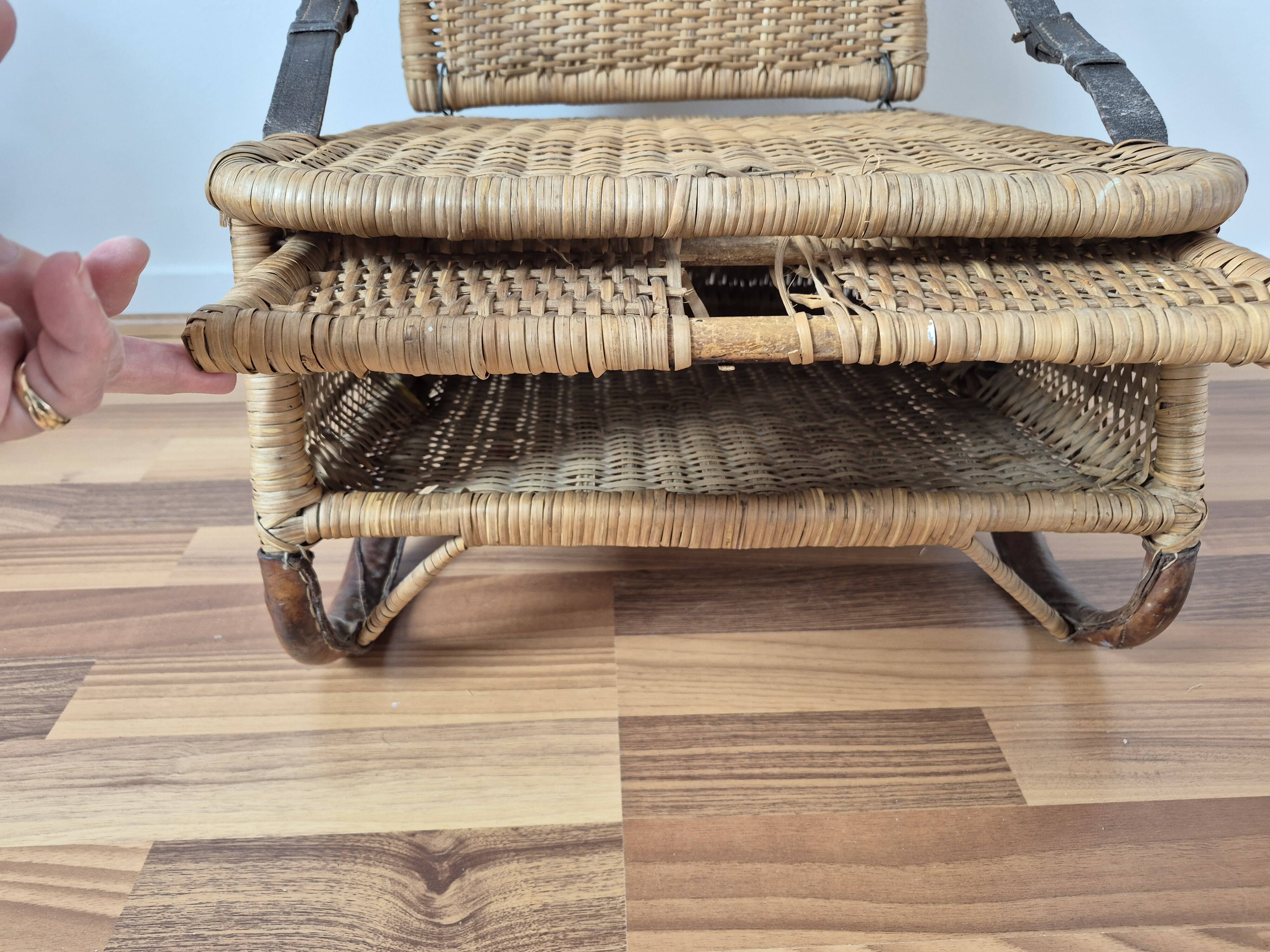 Vintage foldable beach chair, picnic in rattan and leather.