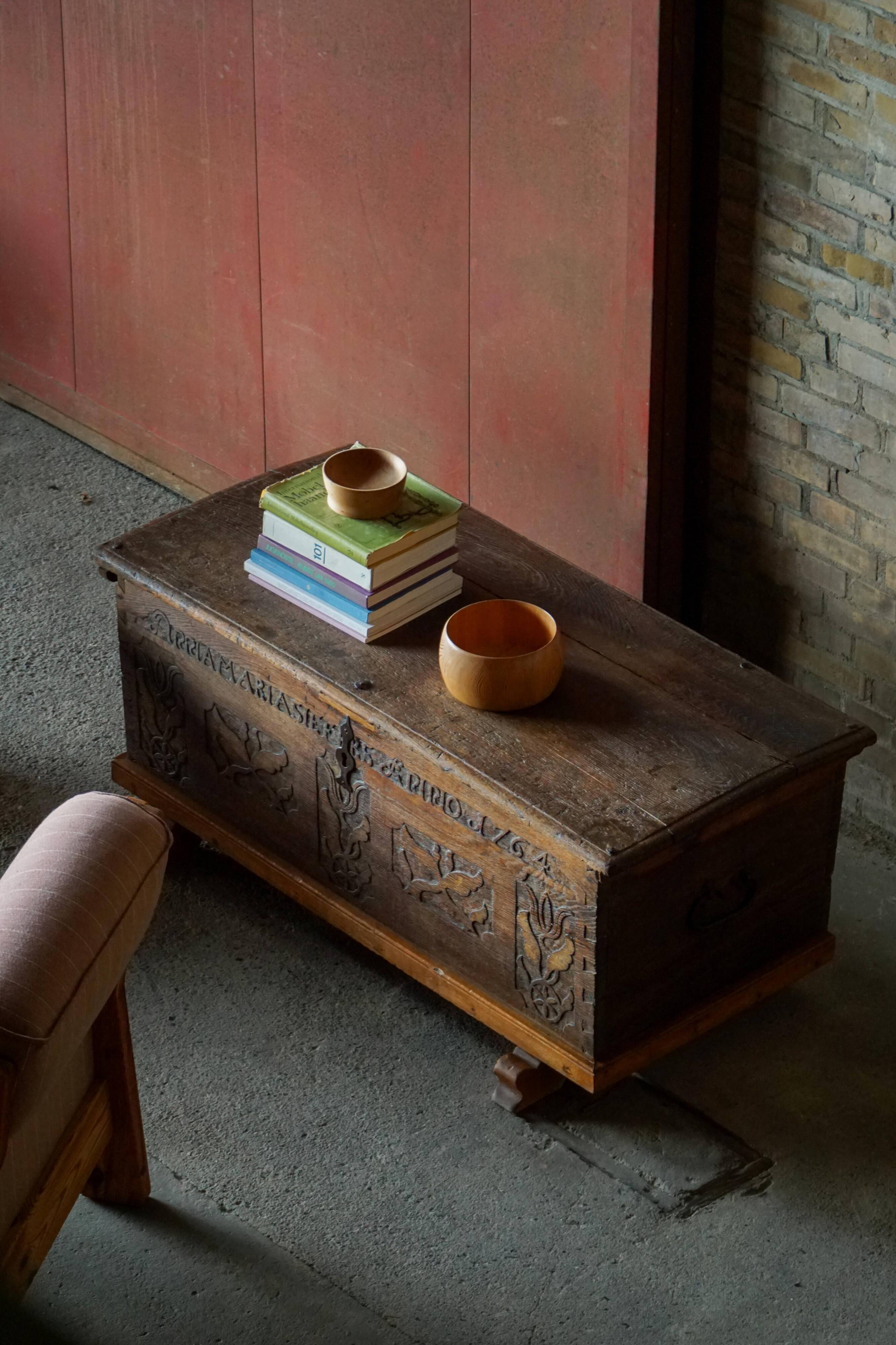 18th-century Scandinavian popular art oak chest with carved panels, dated 1764.