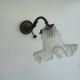 Antique bronze wall light in Louis XVI style - tulip-shaped glass paste flower.