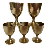 Five brass egg cups