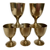 Five brass egg cups