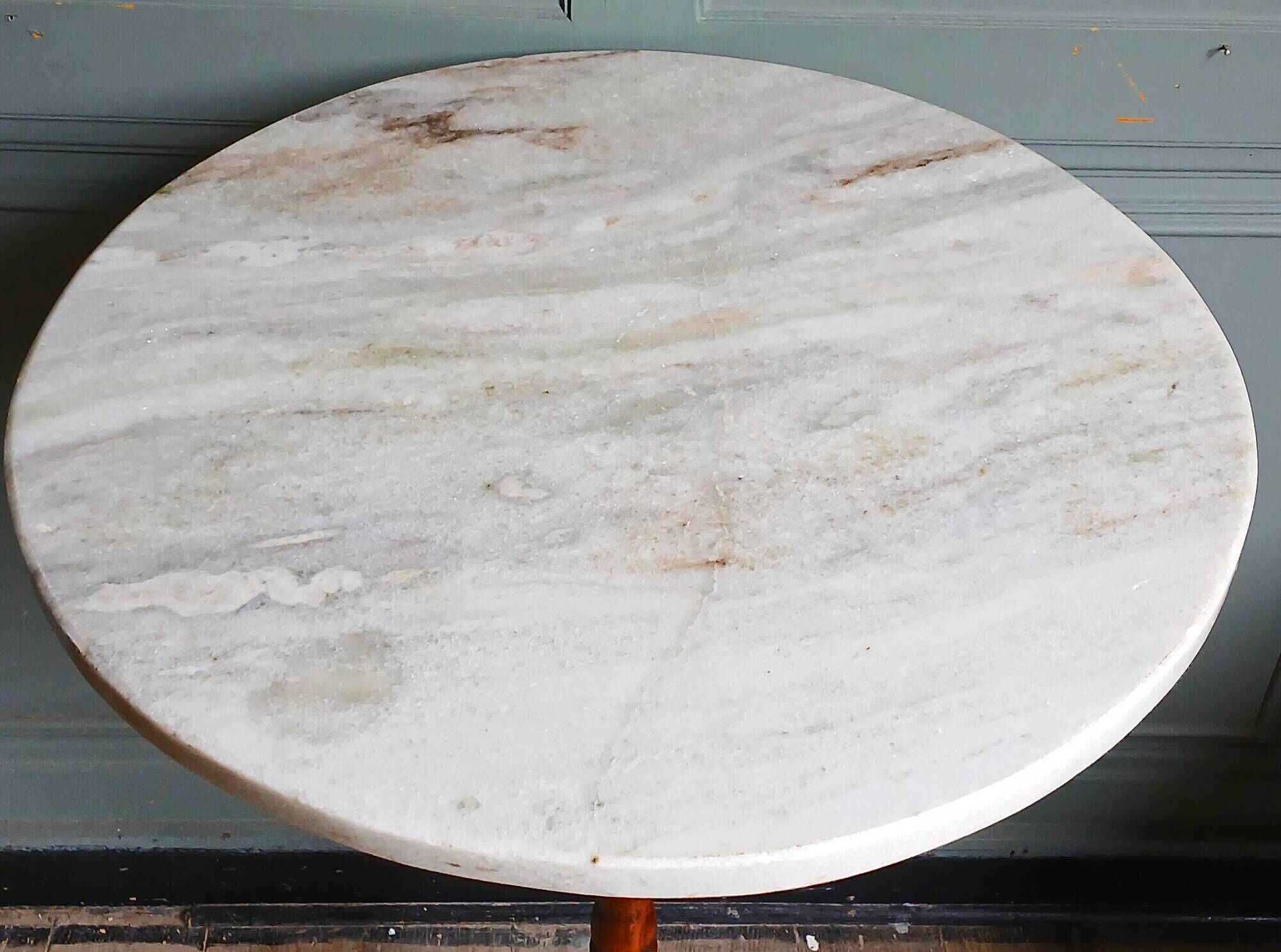 Turned solid wood side table stained with a quartz top.