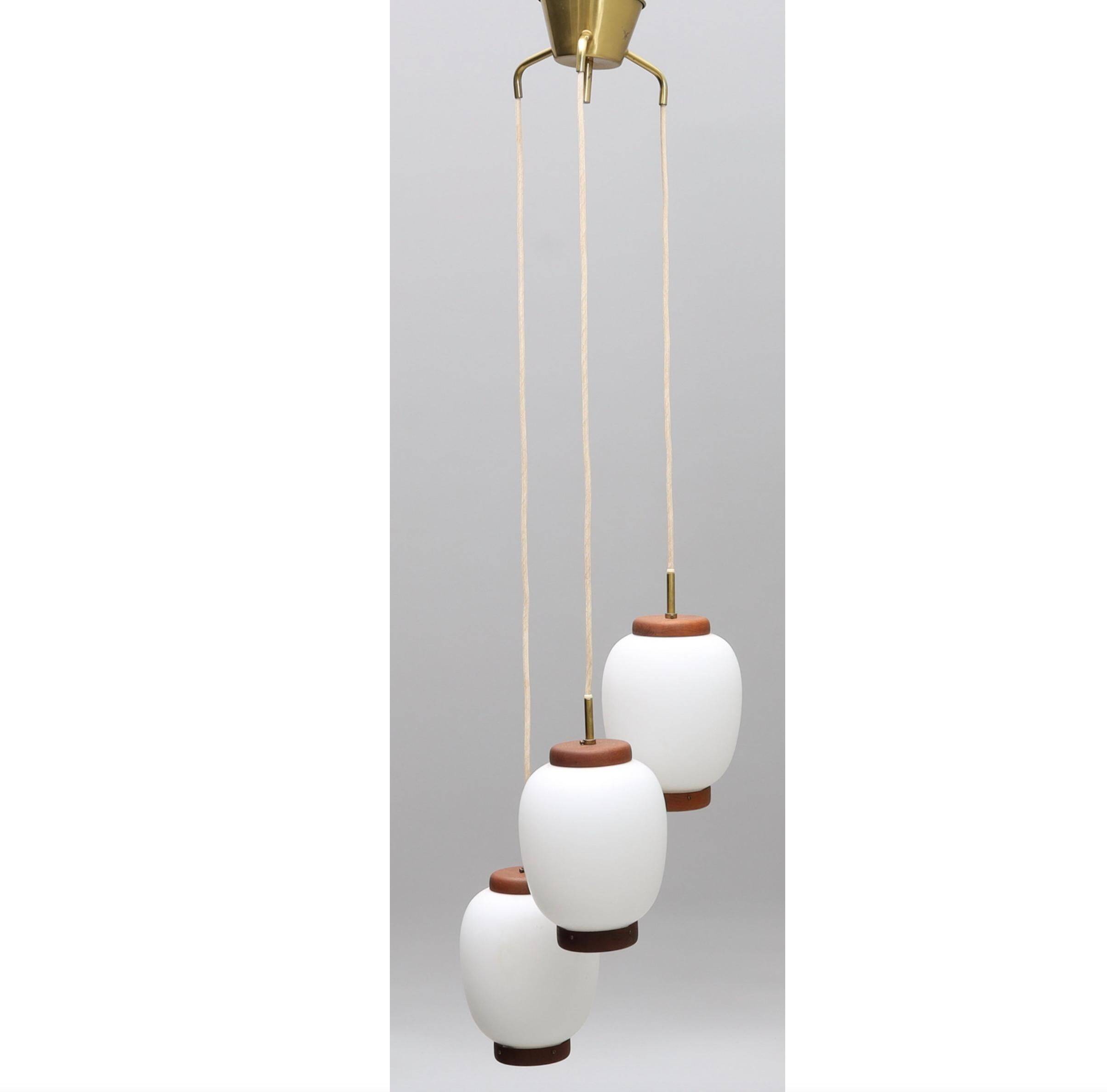 Bent Karlby "China" pendant lights, 3 lights, teak and glass, Lyfa, Denmark, 1960.