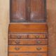 George III oak secretary bookcase circa 1760, Thomas Chippendale style.