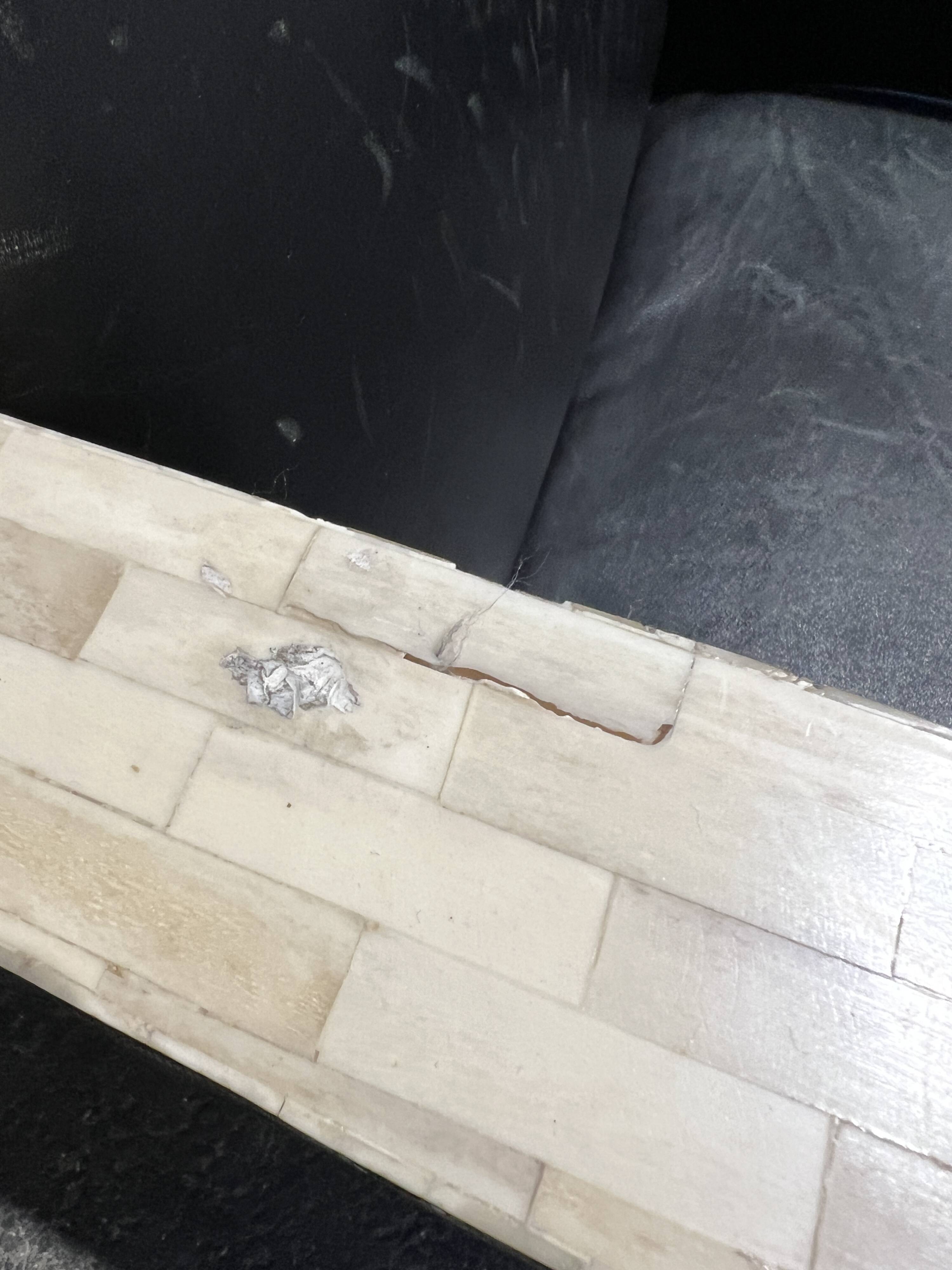 Pair of leather armchairs with marquetry armrests