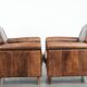 Set of 2 vintage sheepskin armchairs with a characterful appearance