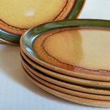Six vintage stoneware plates with green net