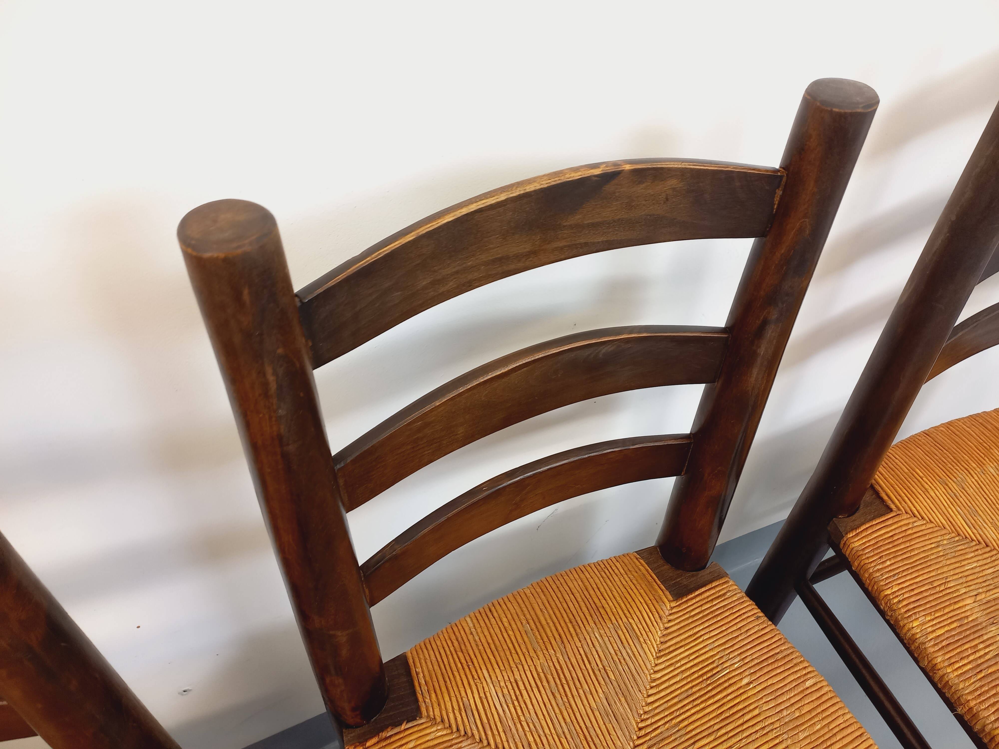 Set of 4 vintage brutalist chairs by Georges Robert in wood and straw.