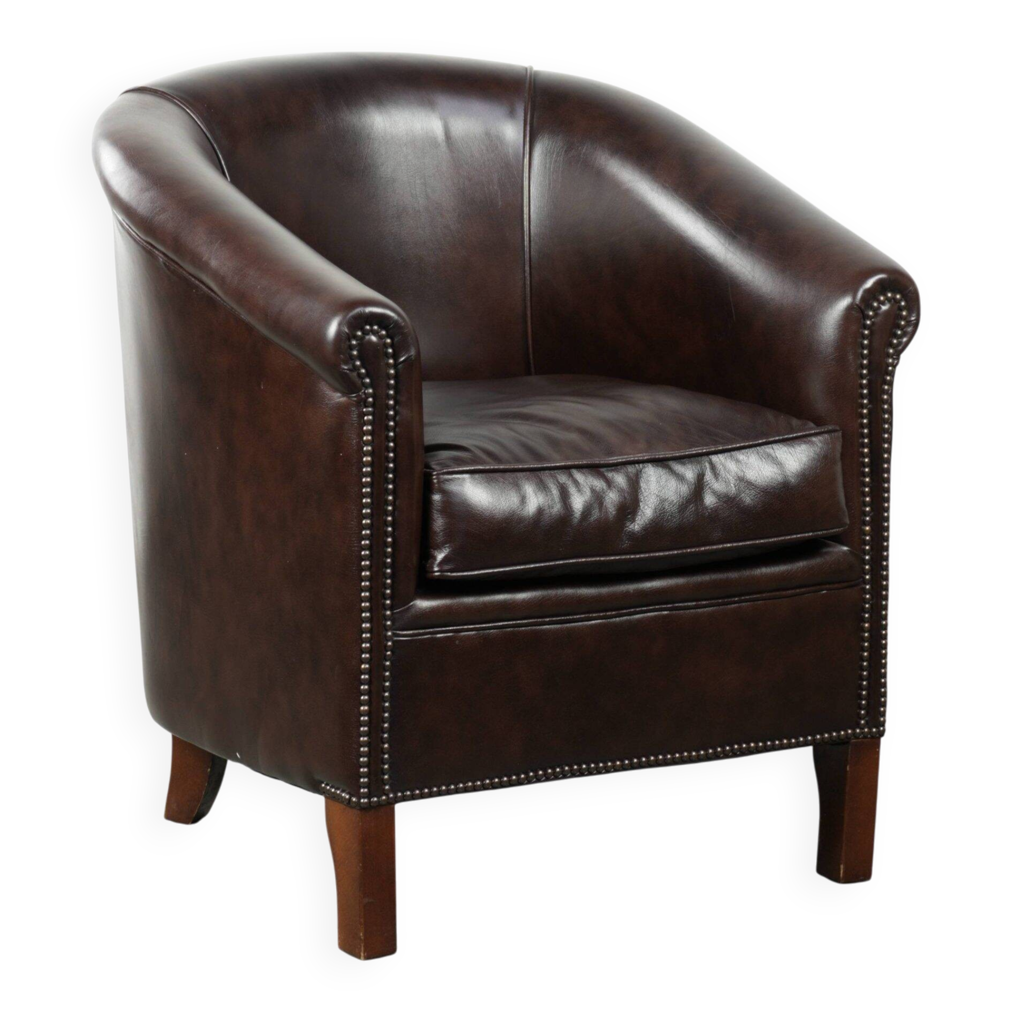 Dark cow leather club armchair in good condition with an English design