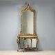 Ancient baroque console with a wooden mirror, Italy, late 19th century.