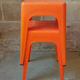 Pair of AMI stools in orange plastic