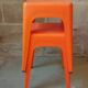 Pair of AMI stools in orange plastic