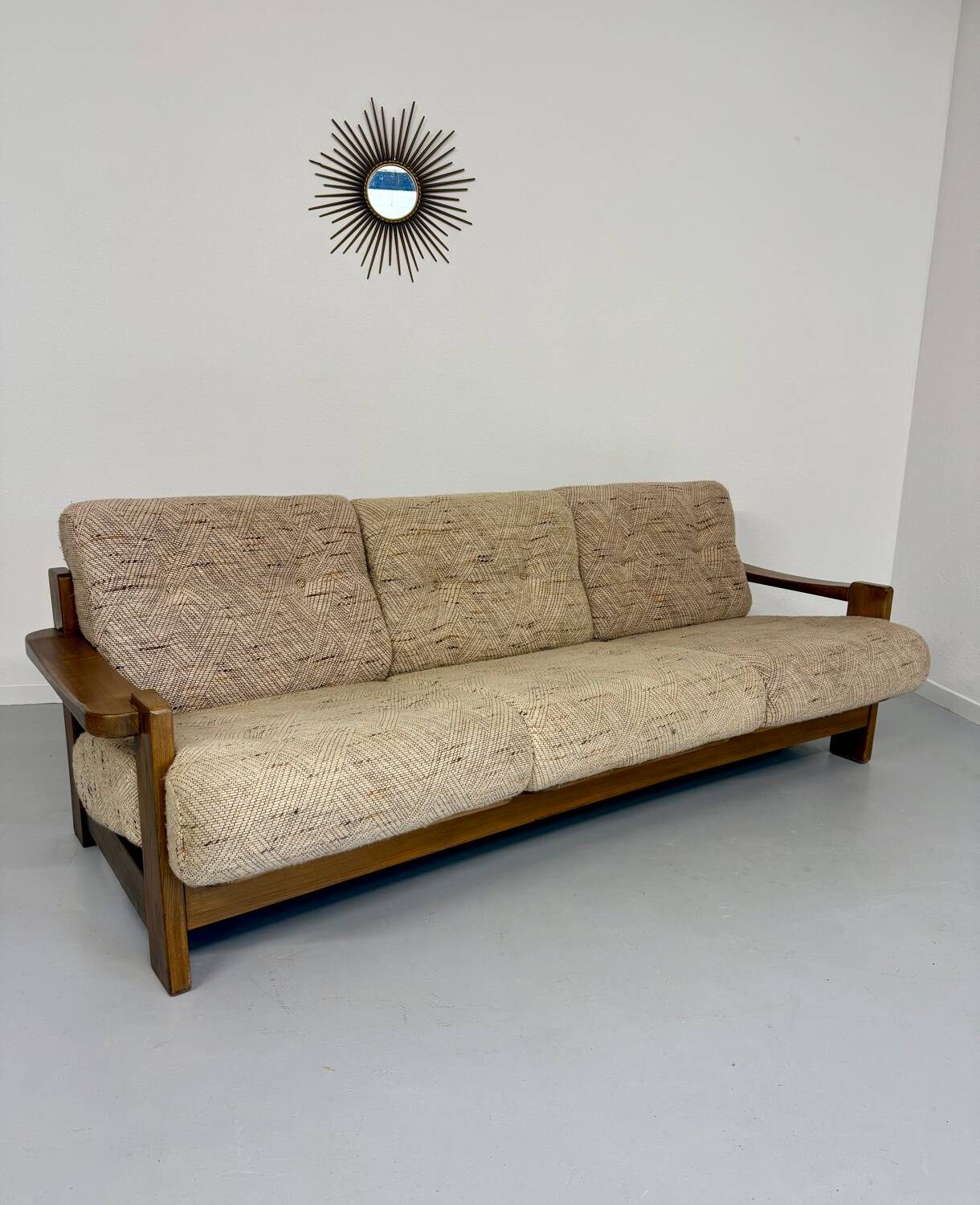 Old 3-seater sofa in solid wood, Maison Regain design, from the 70s.