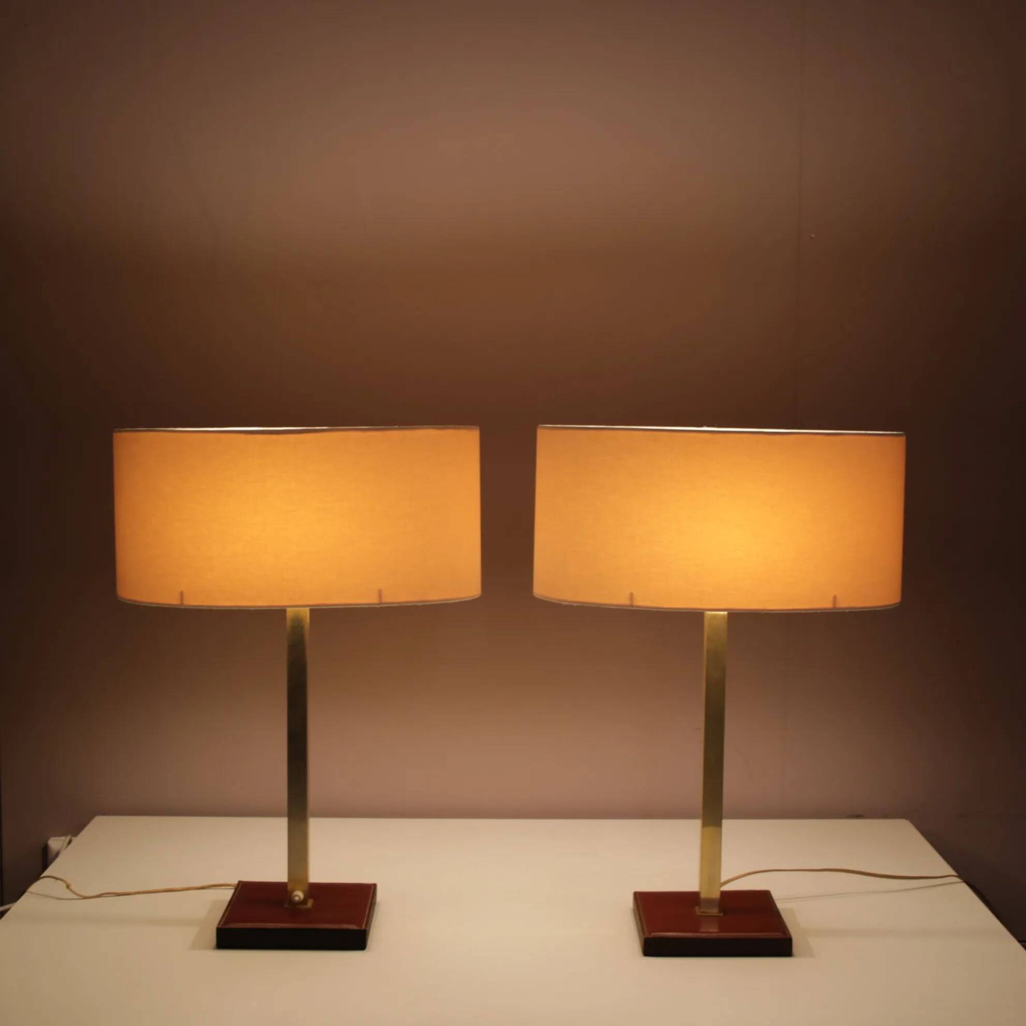 Pair of leather and brass table lamps from the 1960s, originating from Belgium.