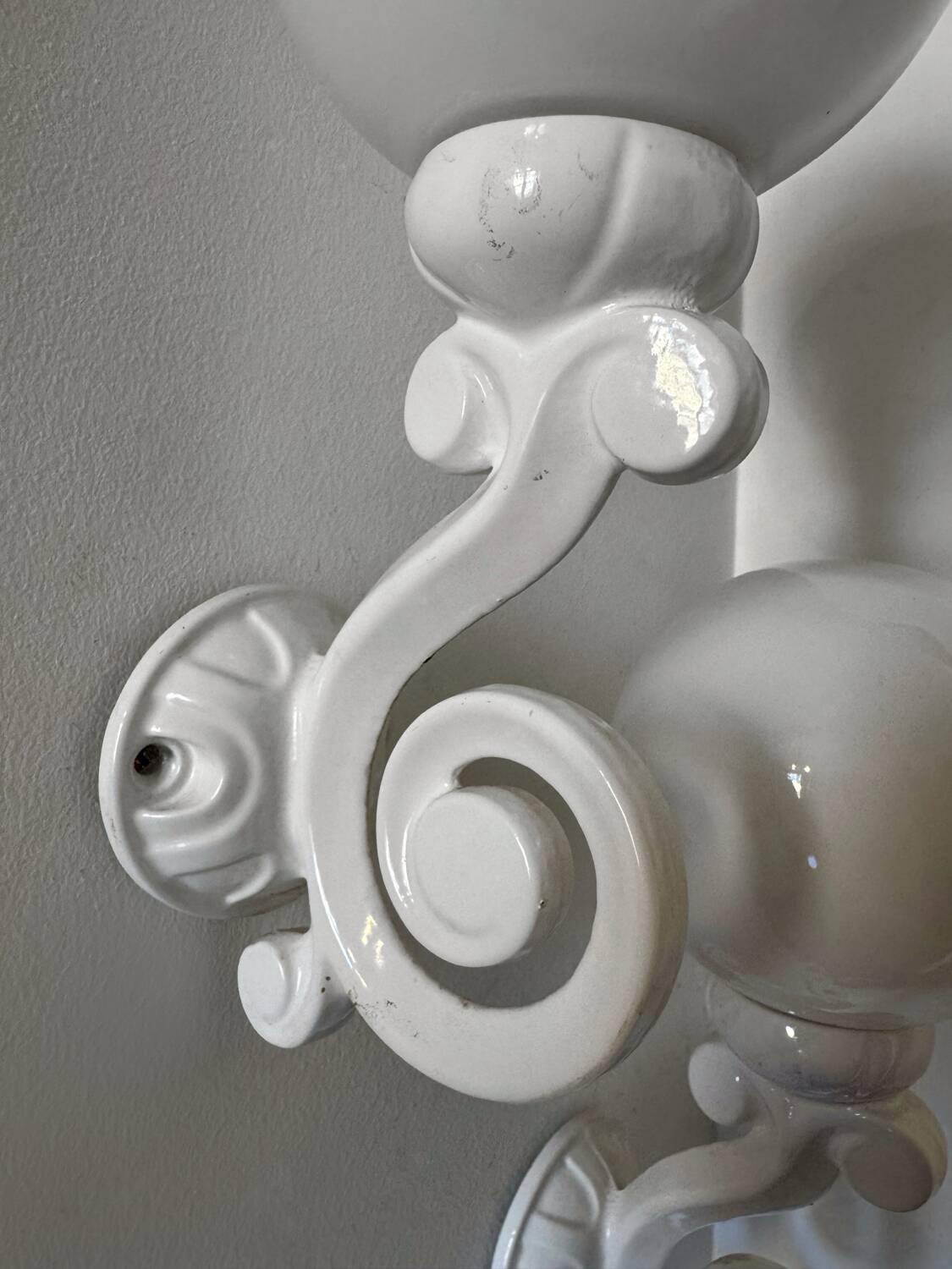 Cast iron and opaline wall lights from the 70s
