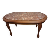 Coffee table with a stone top.