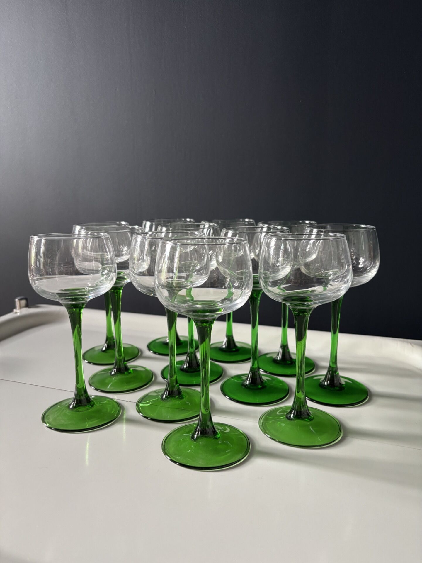 Set of 12 Alsatian Roemer glasses with green stems.