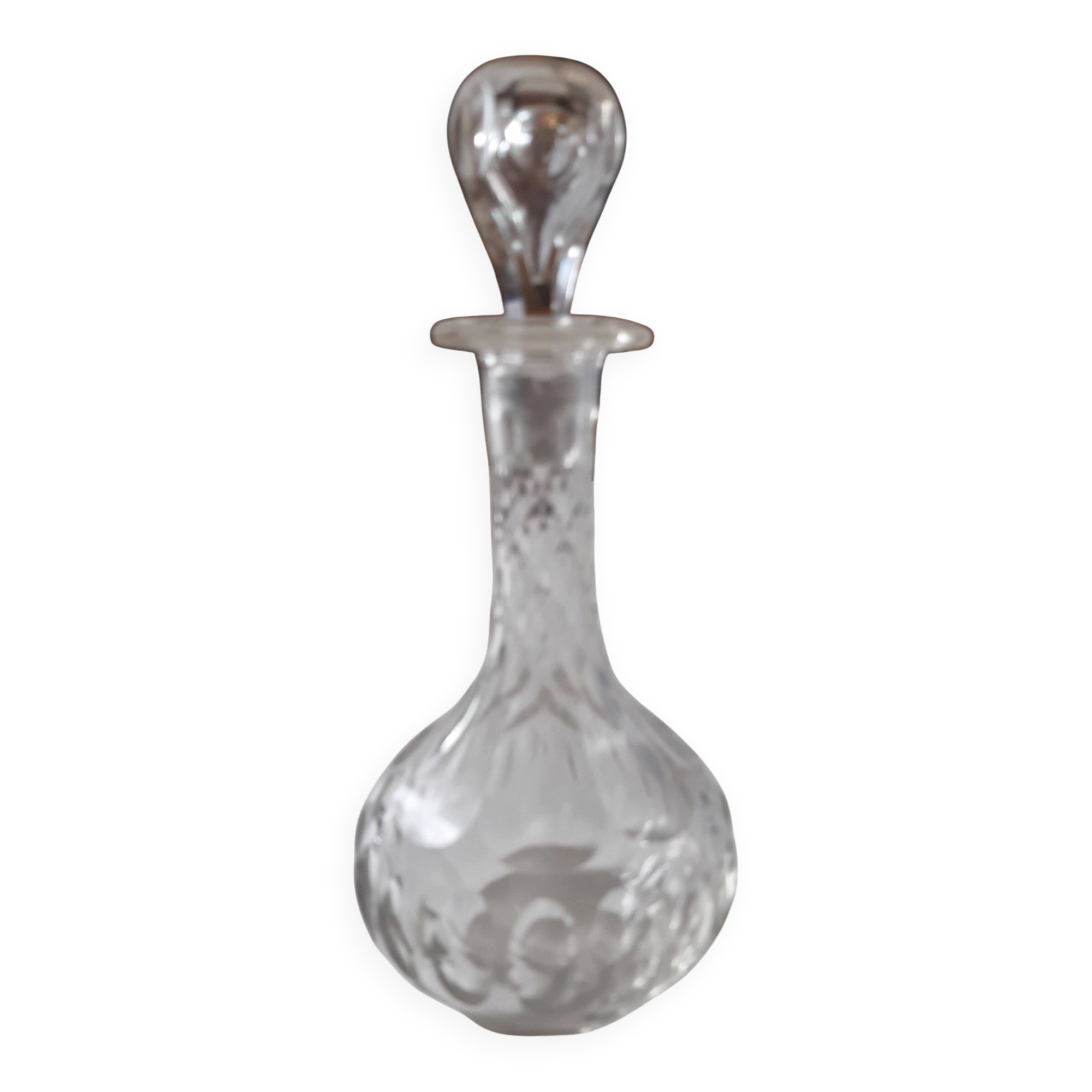 Cut crystal oil bottle with its crystal stopper.