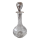 Cut crystal oil bottle with its crystal stopper.