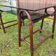 Smoked glass desk on rattan legs and leather detail