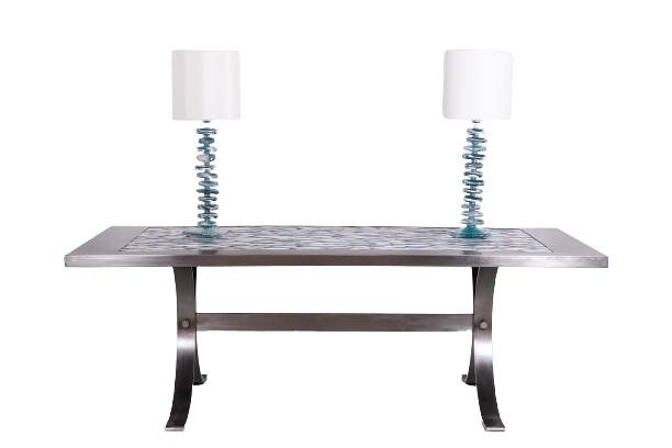 Polished metal and ceramic dining table. 1970s.