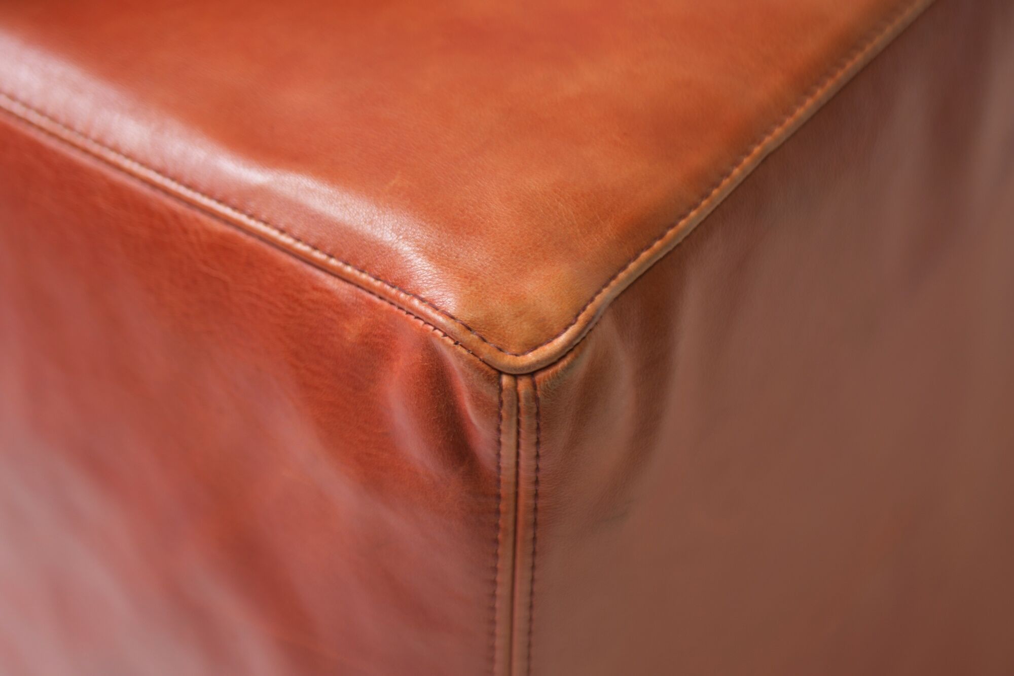 Vintage Osaka loveseat in oxblood leather by Natuzzi Italy