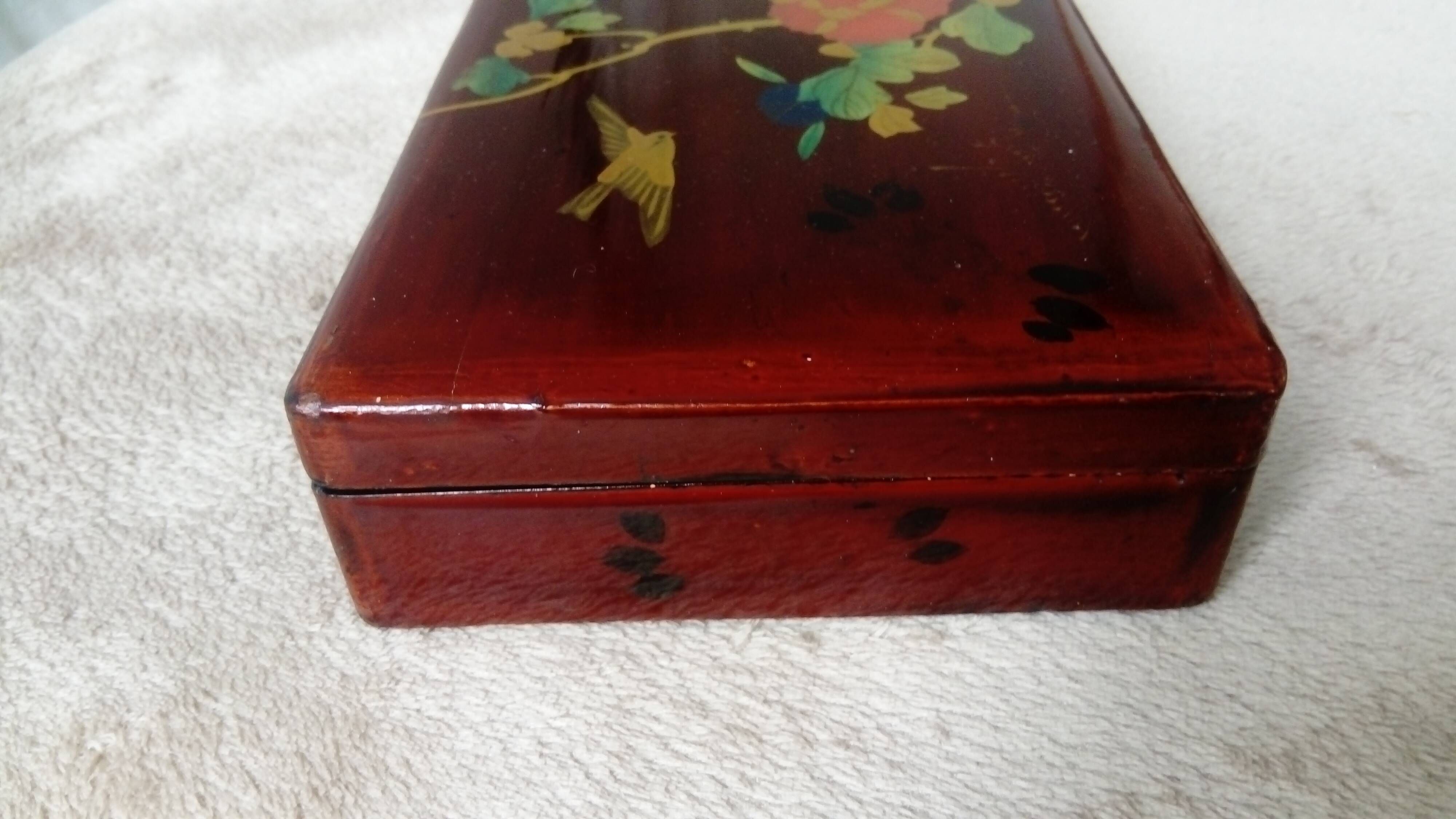 Old lacquered wooden box with china or japan decoration, bird and flower