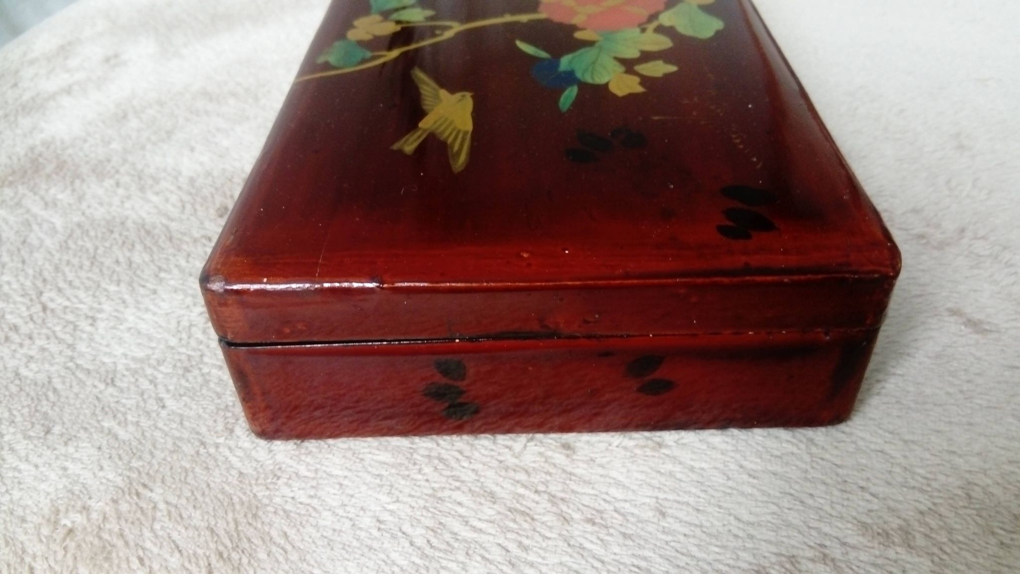 Old lacquered wooden box with china or japan decoration, bird and flower