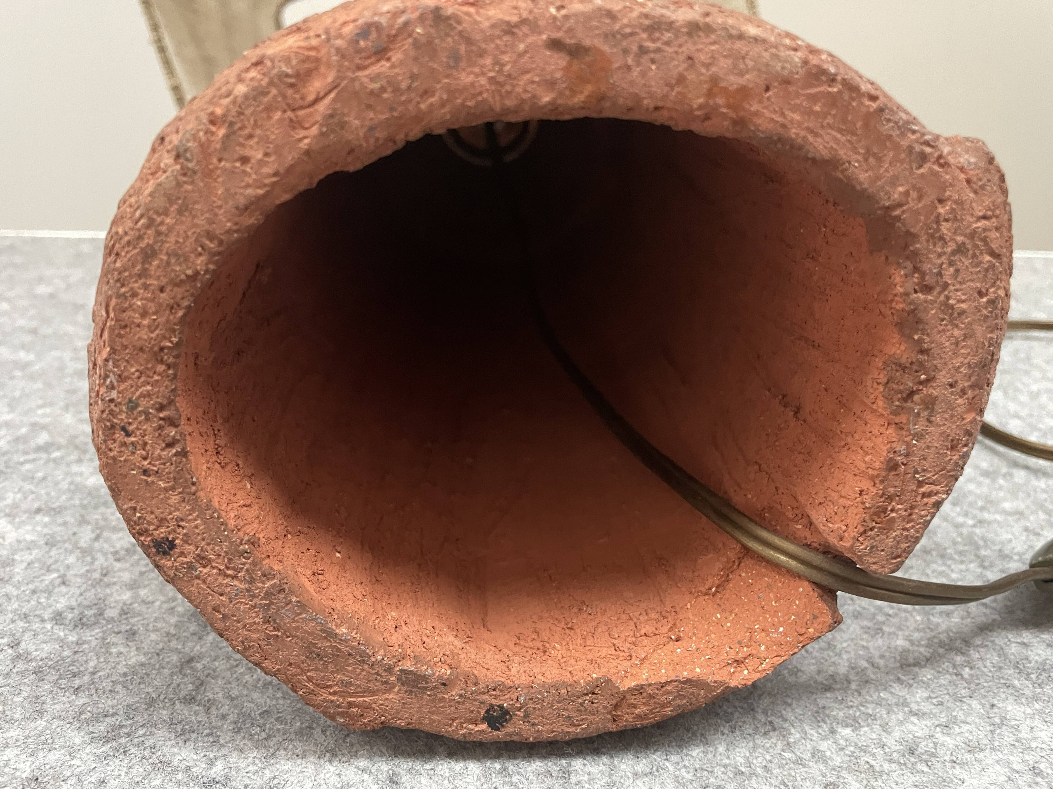 Large chamotte clay lamp in brutalist style, with a plant motif.