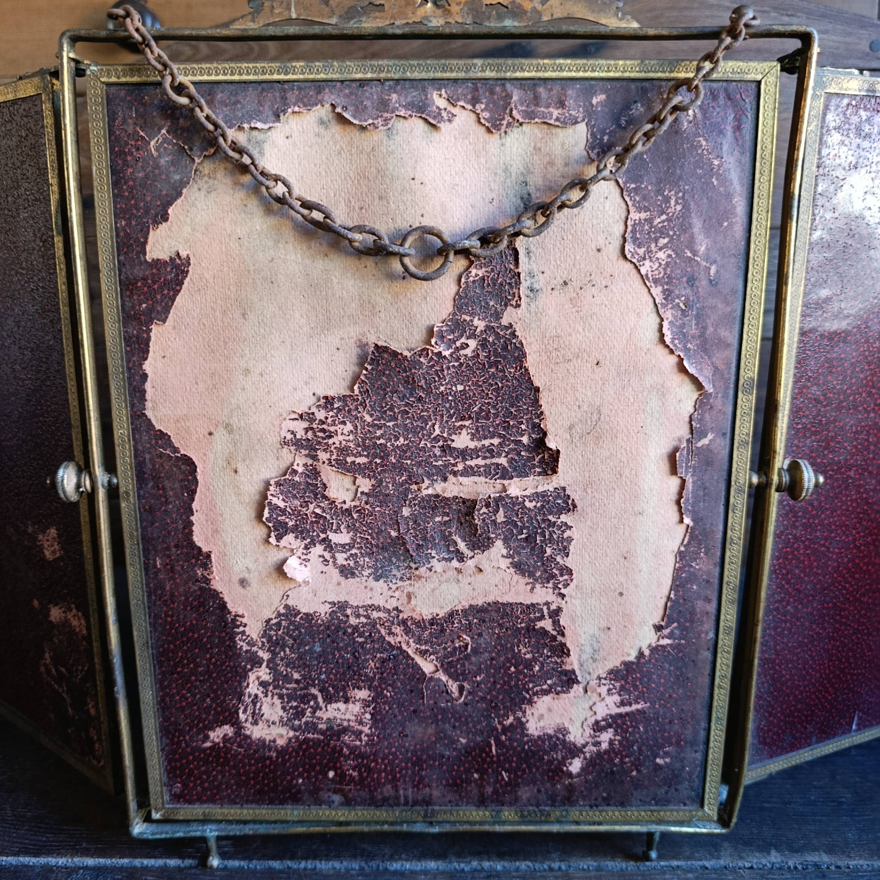 Antique French gilt metal triptych vanity mirror with floral crest