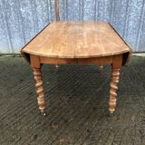 Round table in solid cherry wood, extendable with twisted legs, Louis Philippe style.