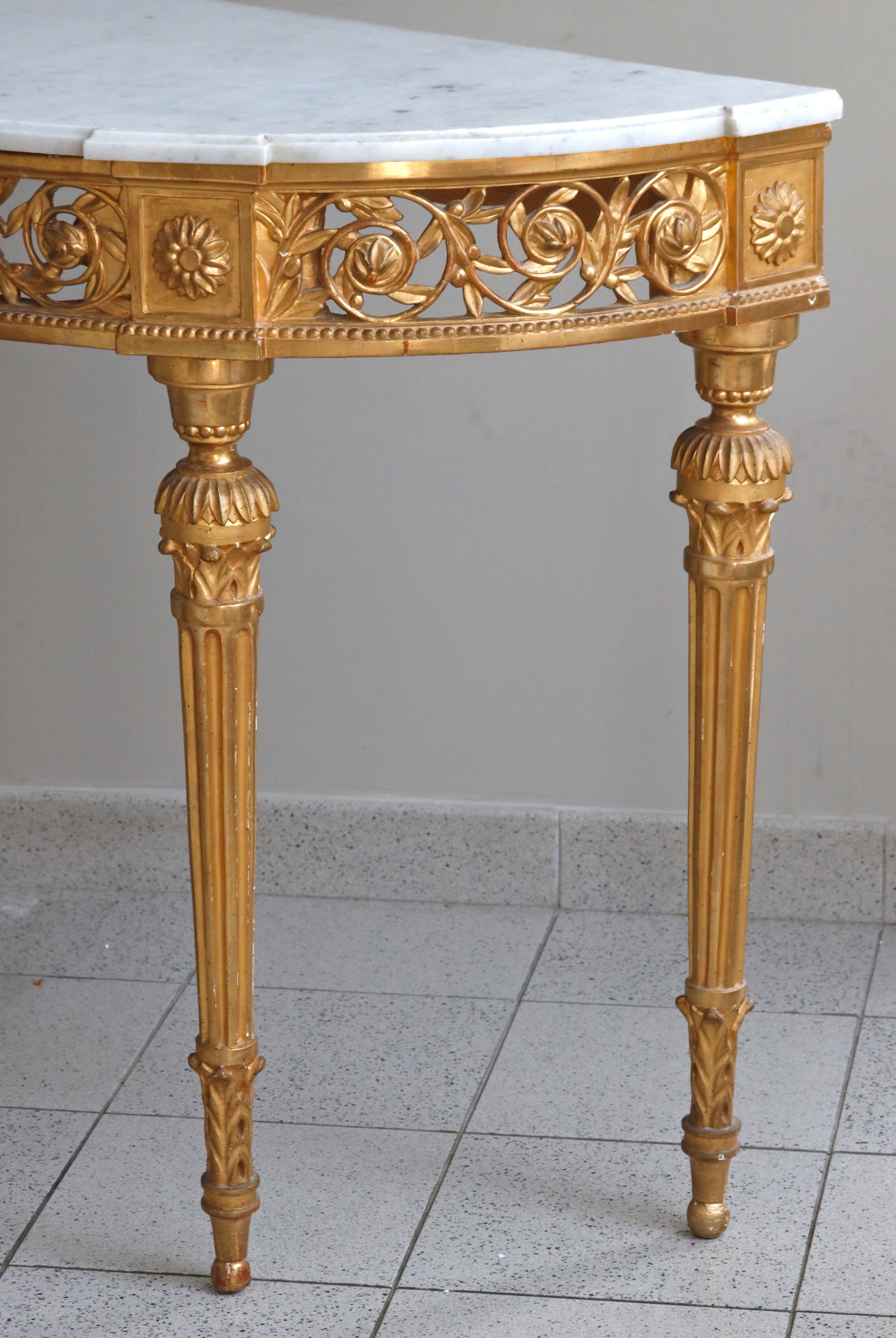 Louis XVI-style gilded wooden console, half-moon in shape