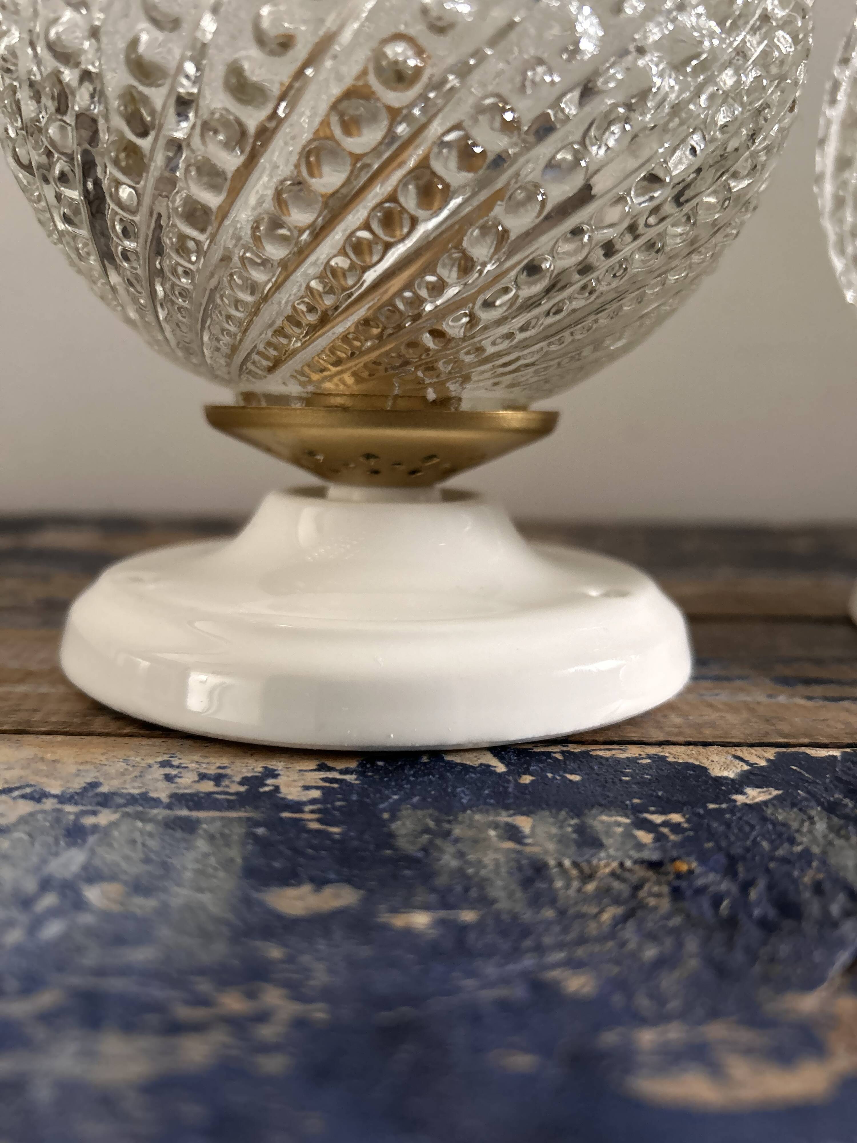 Set of two chiseled glass globe wall lights