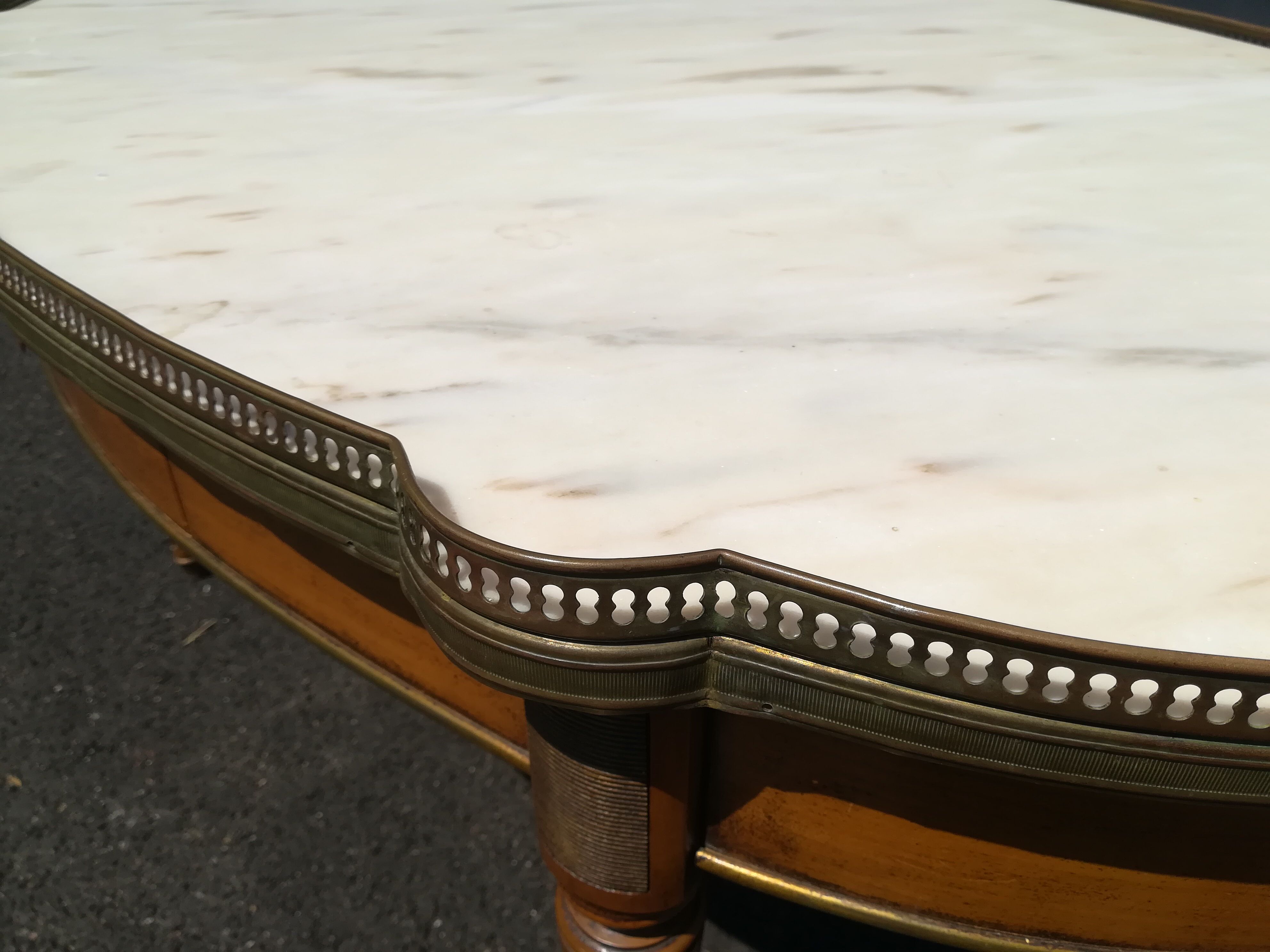 Oval marble and wood coffee table