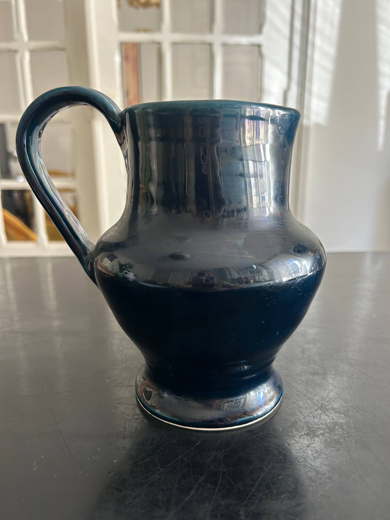 blue pitcher the potter chin