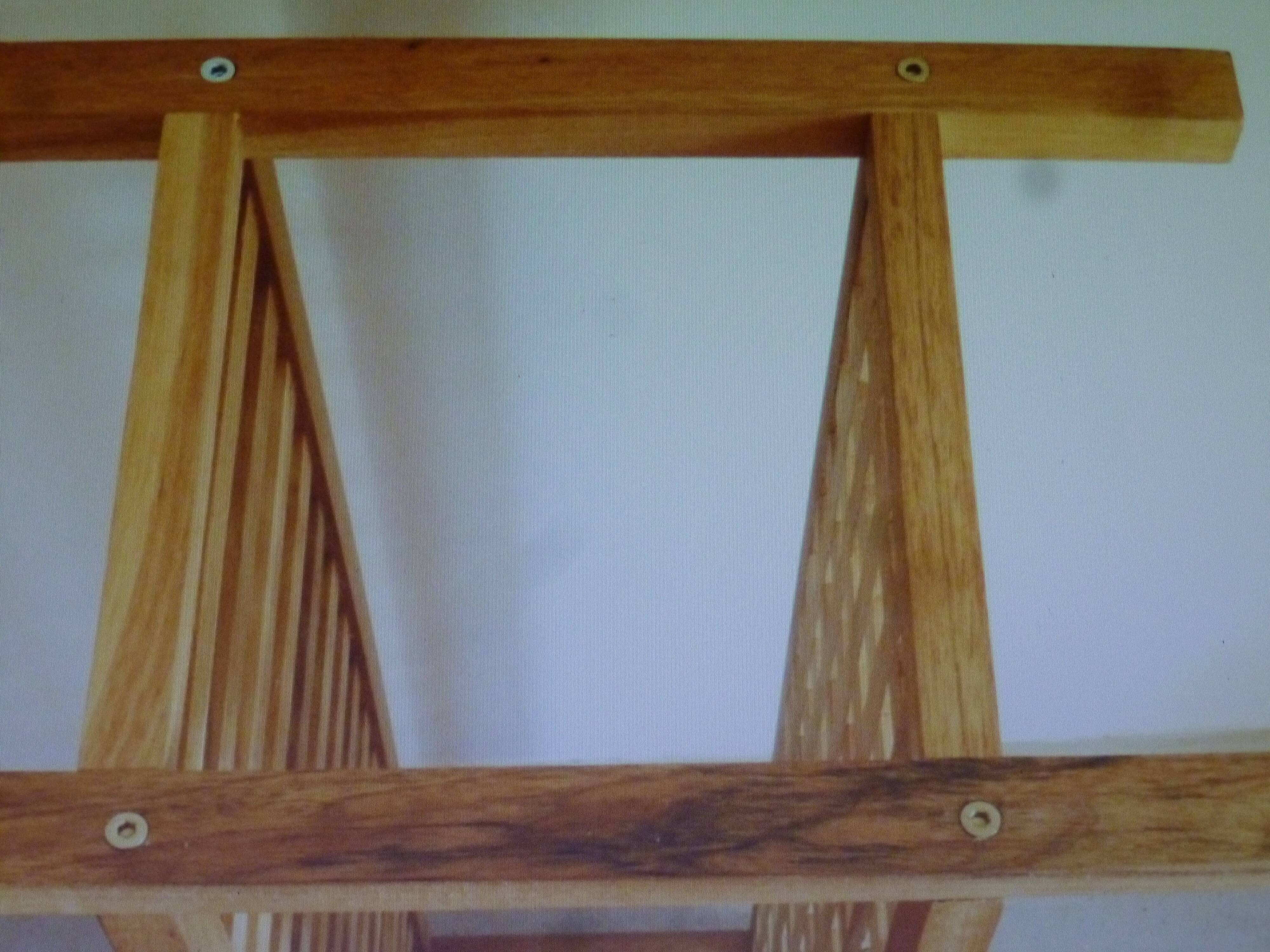 Wooden coffee table with openwork shelves and garden plant holder.