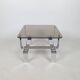 Table basse métal chromé et verre fumé 70