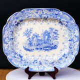 Grand plat décoratif en faïence bleue avec ruine d'abbaye début XIXe siècle.