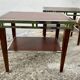 Pair of modernist chrome, leather and wood side tables.
