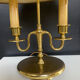Directoire style bouillotte lamp in brass with double lights.