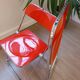 Four red Plia chairs – Anonima Castelli