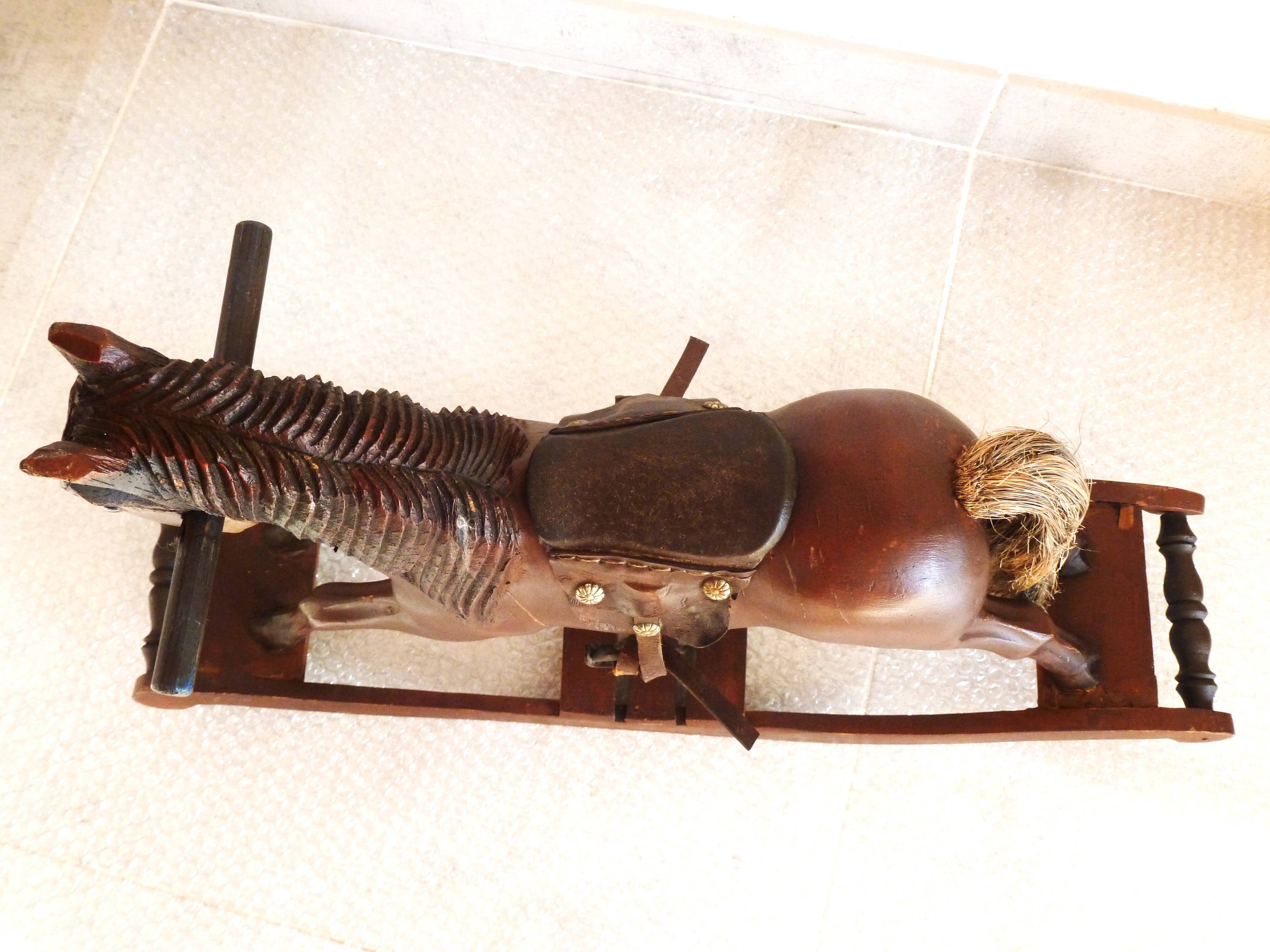 Antique wooden and leather rocking horse